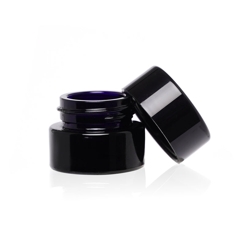 A small black childproof screw top glass jar.