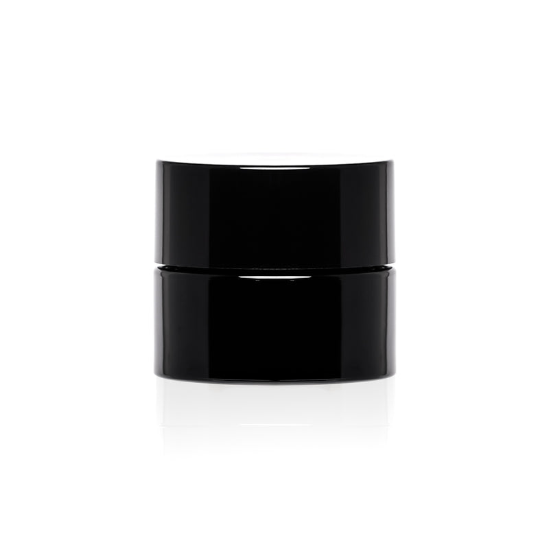 A small black childproof screw top glass jar.